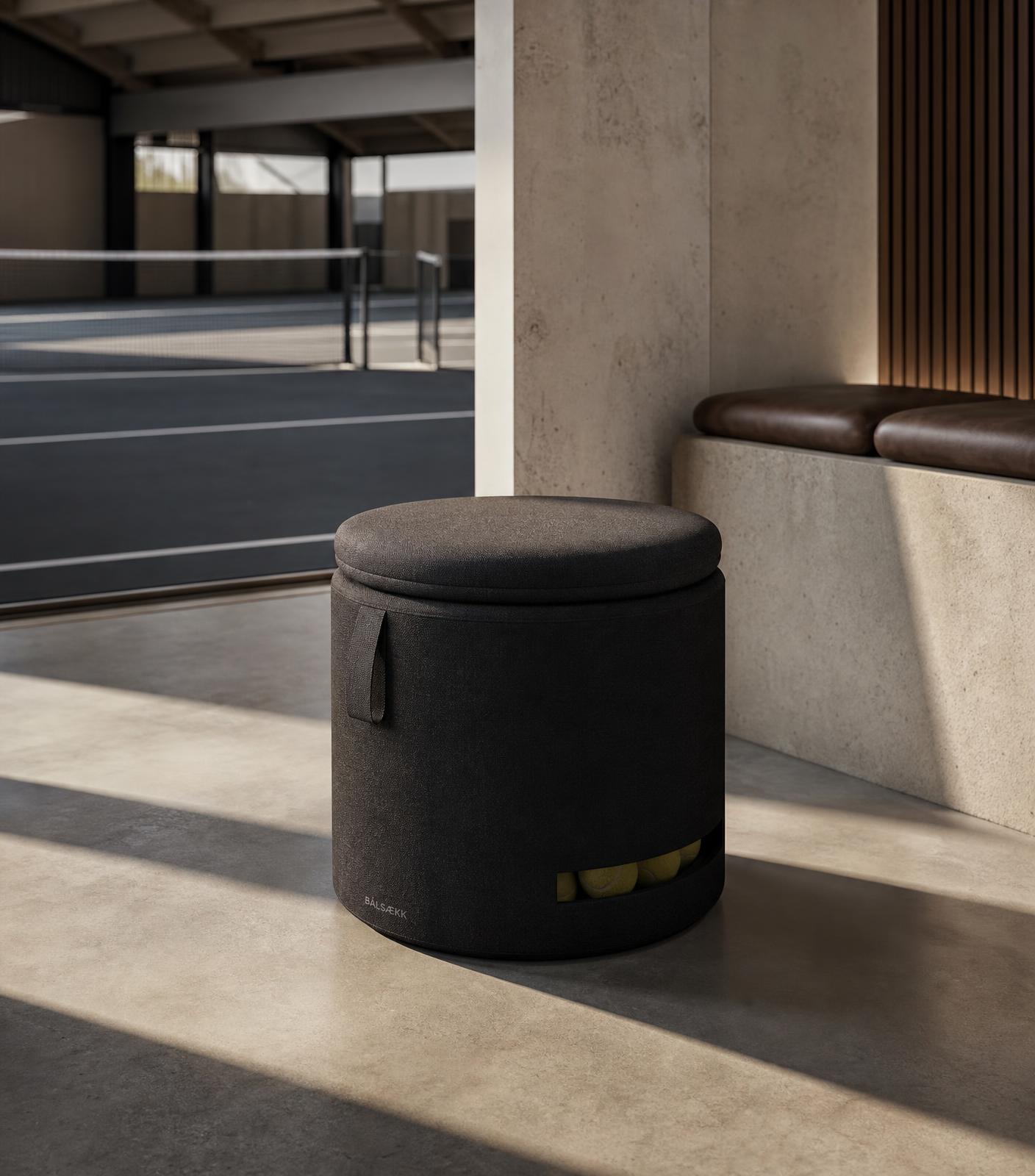 Compact dark Bålsækk seating concept with reused tennis balls subtly visible